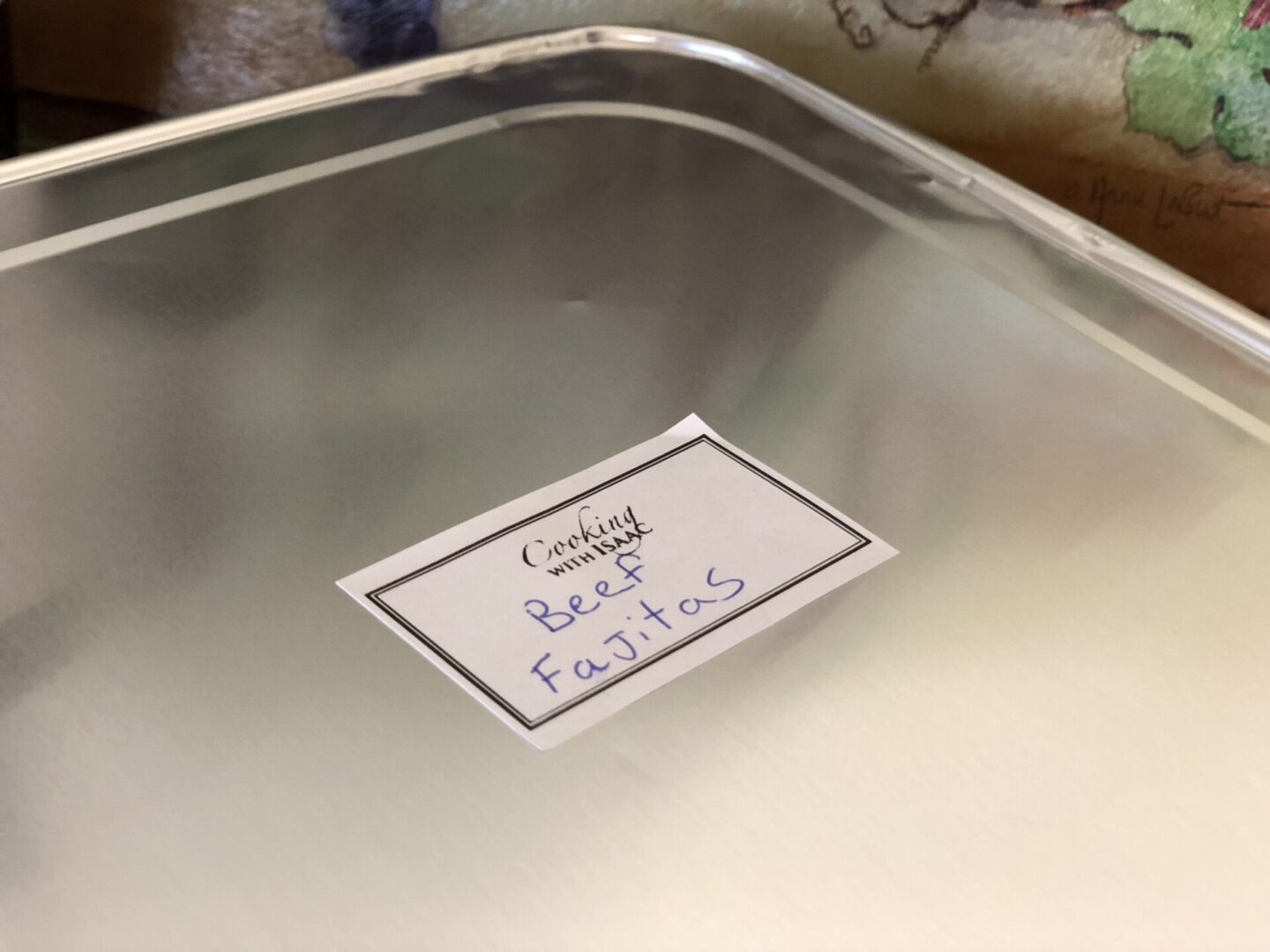 A metal pan with a label on it.